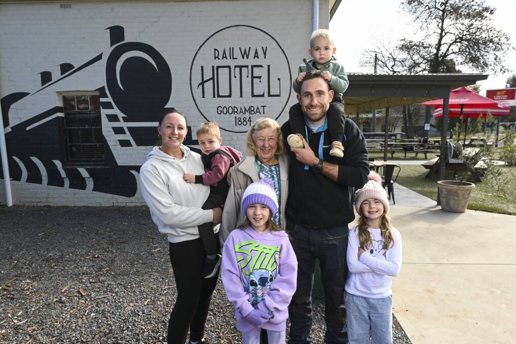 Jemma Beilharz and her husband Nik hold their sons Banjo, 2, and Max, 3, as they joined grandmother Joan Kneebone and nieces Isla and Zarli Holmyard, aged 7 and 9, at the Railway Hotel at Goorambat following their train journey. Picture by Mark Jesser 