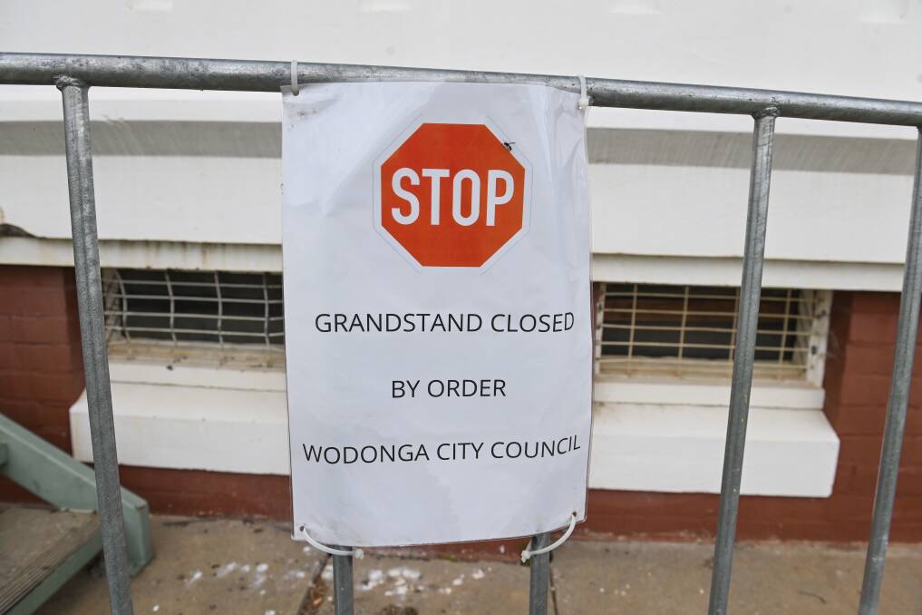 A barrier erected at the rundown grandstand at Wodonga racecourse spells out the status of the viewing point. Picture by Mark Jesser.