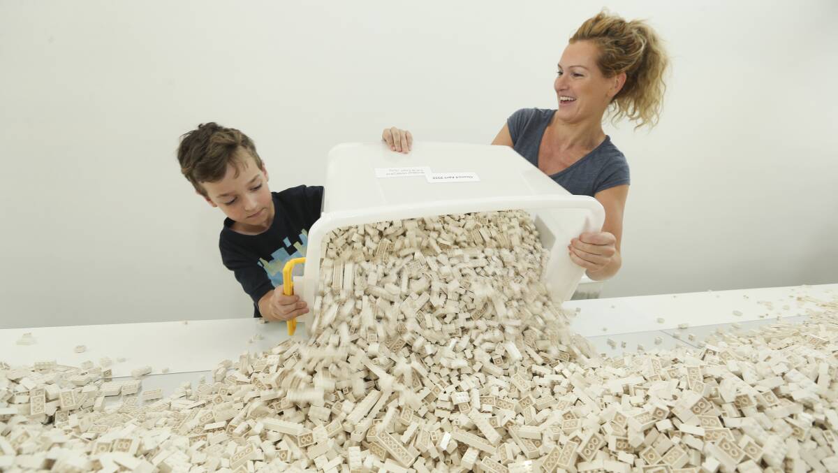 Ready to build: Albury's Natalie Hine with her son Jonny, 8, help unload the boxes of Lego at MAMA. Picture: ELENOR TEDENBORG