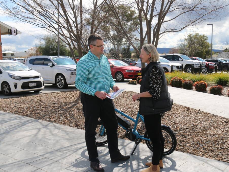 Wodonga mayor Kev Poulton and council sport and recreation manager Liona Edwards at a part of Junction Place slated for a bicycle hub. Picture by Wodonga Council.