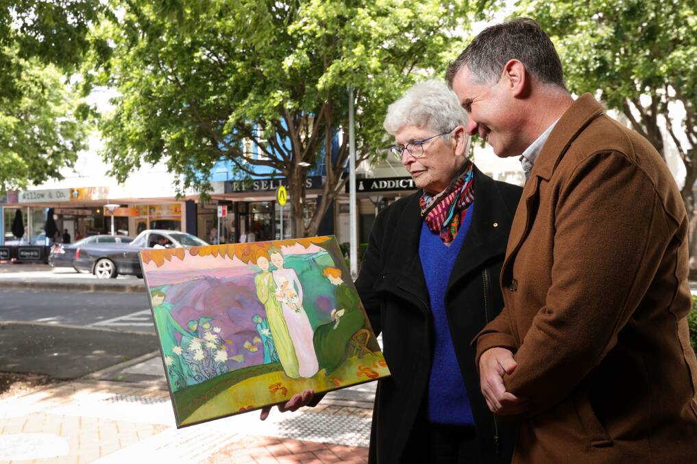 Penny Vine and Justin Clancy with Border artist Maree Kenny's version of French painter Maurice Denis' October Evening which will be put on the wall of a house for refugees. Picture by James Wiltshire.