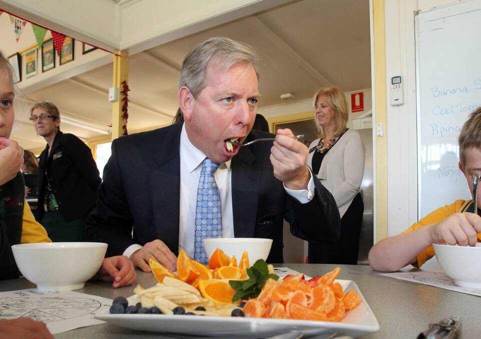 David Davis when he was Victoria's health minister in 2013 enjoys some food at Wodonga West Primary School. 