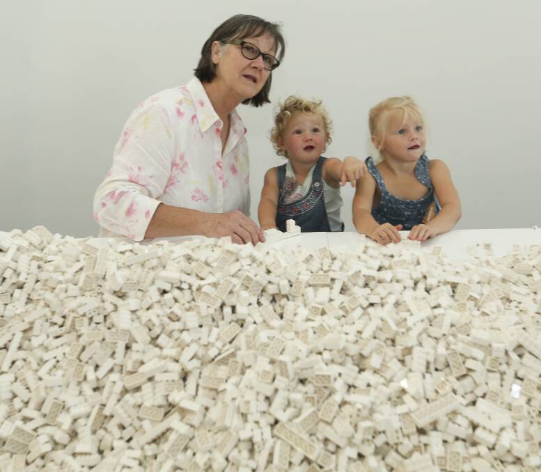 Chock-a-block: Thousands of Lego pieces have been released at MAMA for the enjoyment of visitors such as Albury's Andrea Clements and her granddaughters Elle, 20 months, and Lacey, 3. Picture: ELENOR TEDENBORG 