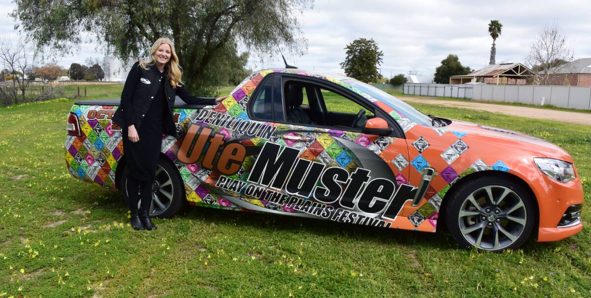 Revved up: Ute Muster project co-ordinator Stephanie Holahan is ready for a big weekend as Deniliquin prepares for an influx of cars from across the country. The promotional ute features stickers from the event's 17-year history.