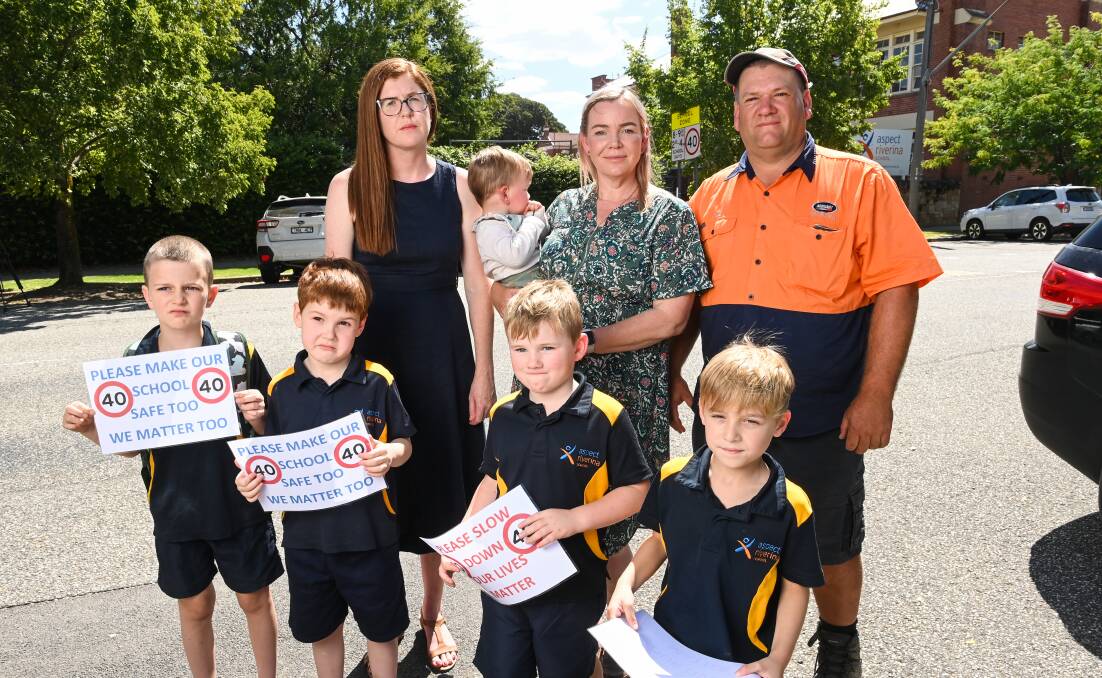 Aspect parent Rebecca Schischka (back left) with fellow parents and students. She spoke to Albury Council of her concerns about traffic woes. Picture by Mark Jesser