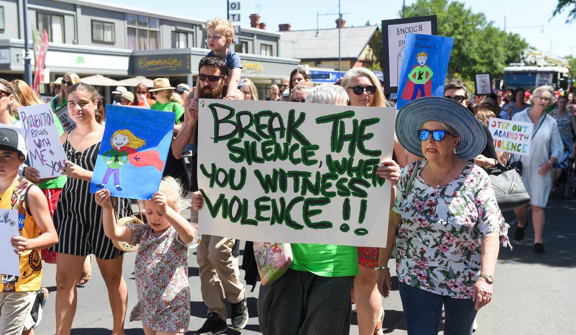 Citizens participate in a Step Out Against Violence march in Albury, one of various activities supported by the city council to fight thuggery.