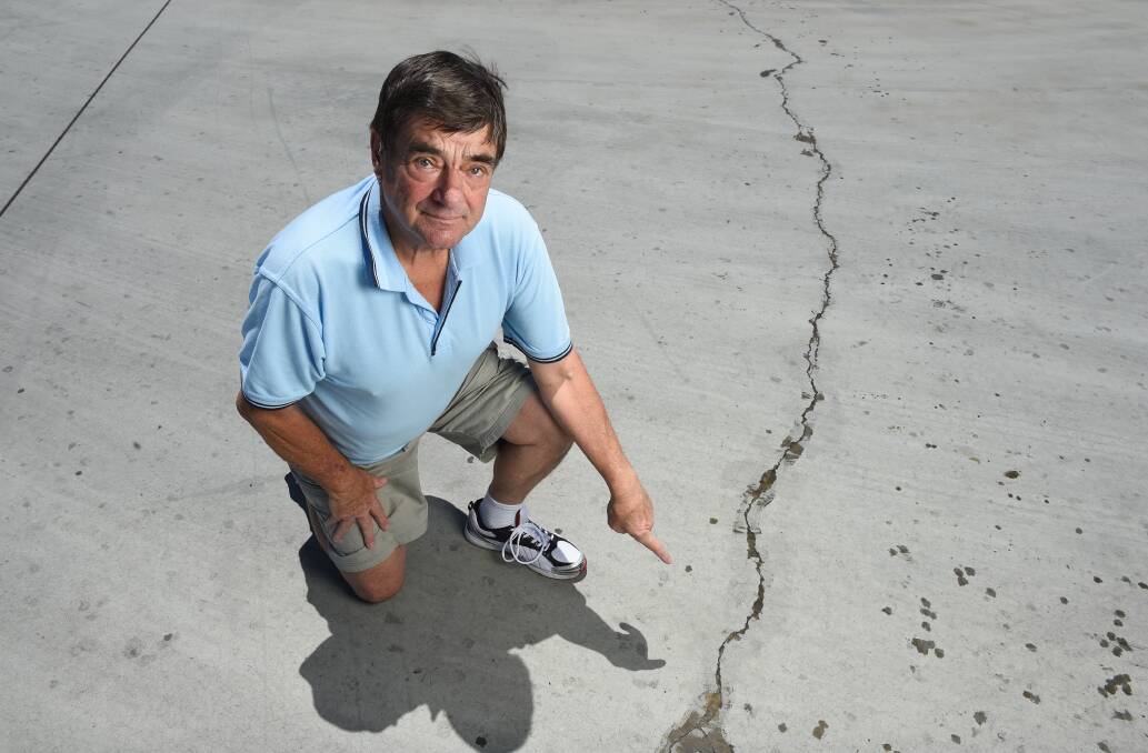 Crack case: Ratepayers boss Ian Deegan points to a crack filled with a seal at the truck stop at Barnawartha North. Picture: MARK JESSER