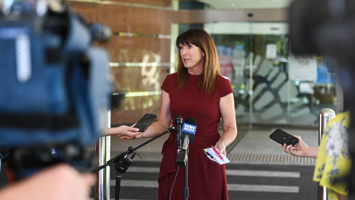 Kylie King faces microphones outside Albury Council chambers. The city leader is likely to get the opportunity to face Upper House politicians holding a hearing in her city about council financial strains. Picture by Mark Jesser