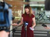 Kylie King faces microphones outside Albury Council chambers. The city leader is likely to get the opportunity to face Upper House politicians holding a hearing in her city about council financial strains. Picture by Mark Jesser