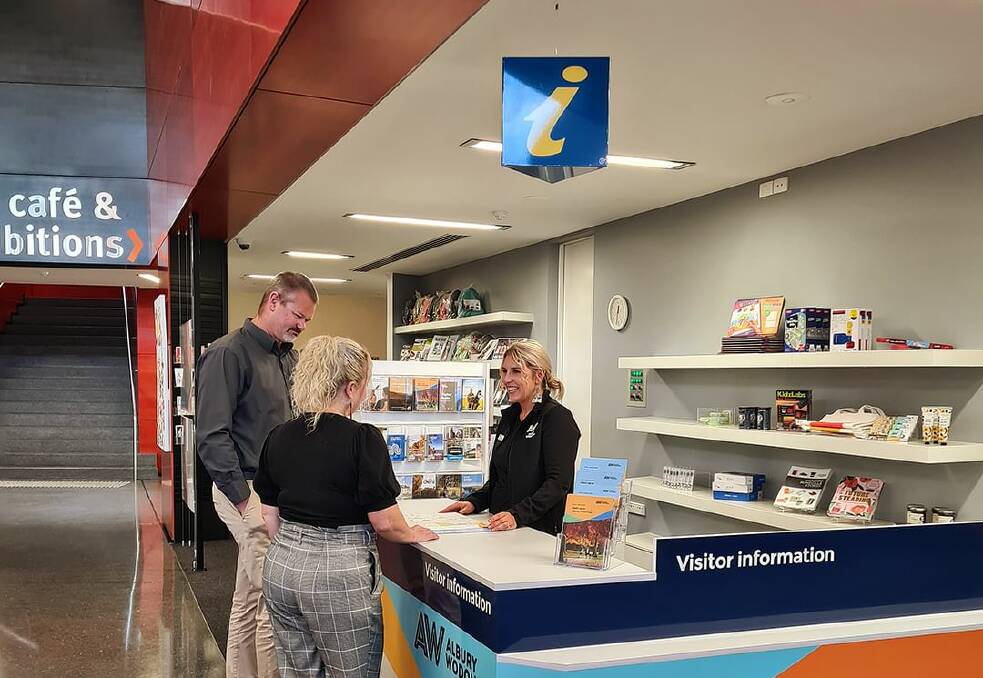 A promotional shot taken by Visit Albury Wodonga showing the counter for visitors, complete with the yellow letter icon above the desk.