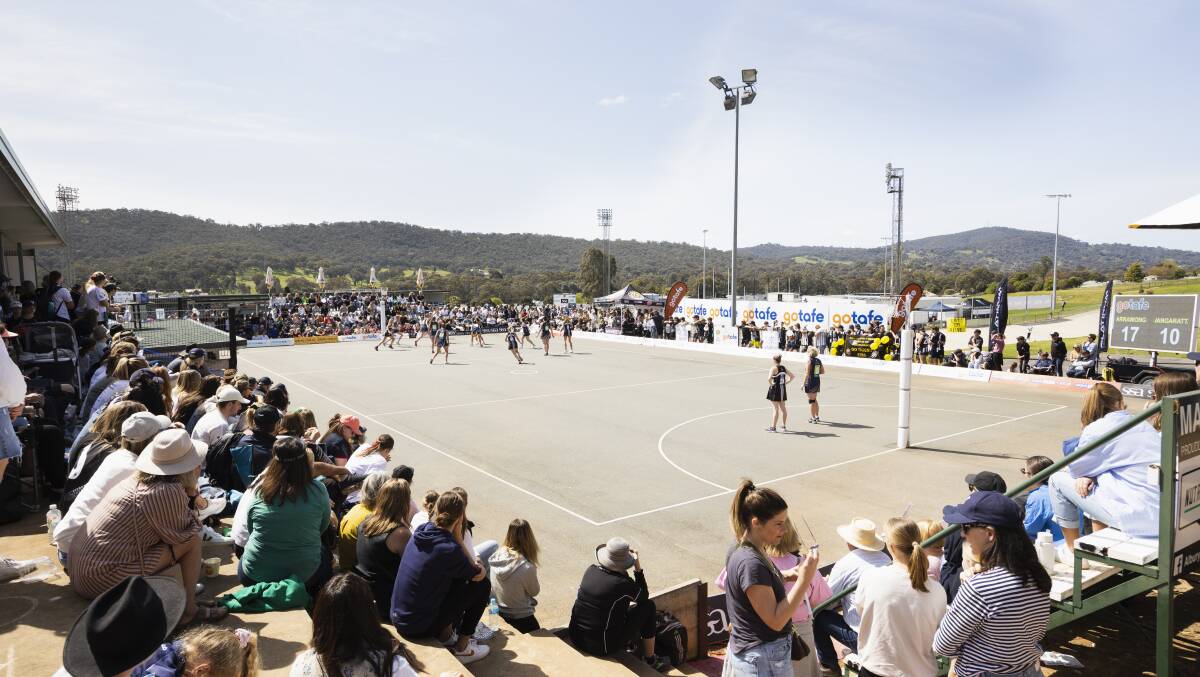 The Ovens and Murray netball grand final at Lavington last year between Yarrawonga and Wangaratta. The O&M Live radio crew broadcast team is under a black shade at the end at which play is unfolding. Picture by Ash Smith