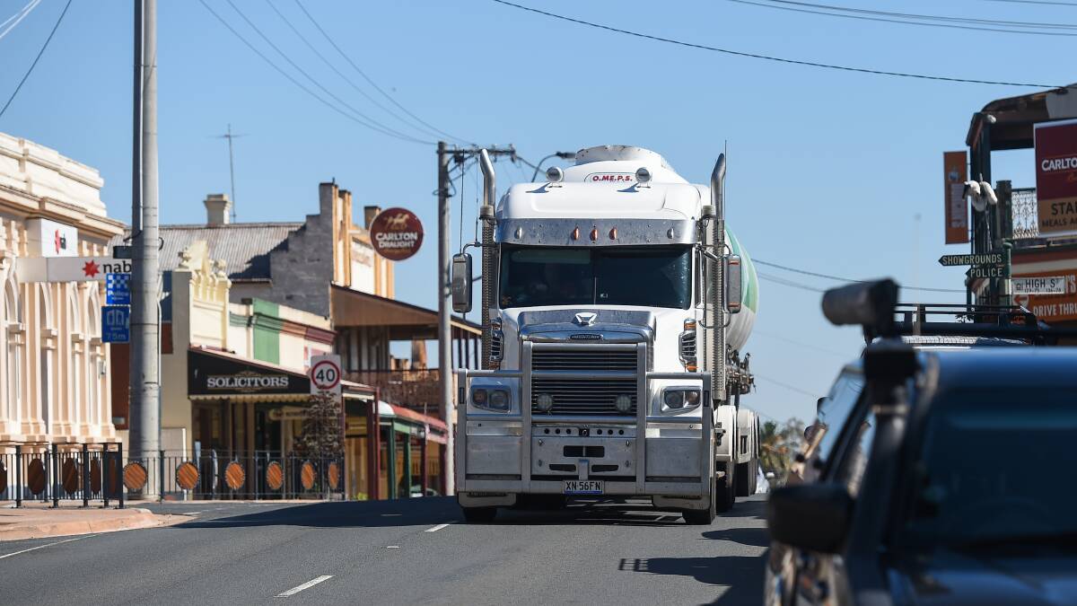 A truck travels through central Rutherglen. Efforts to have a heavy vehicle bypass developed by Regional Roads Victoria have failed.