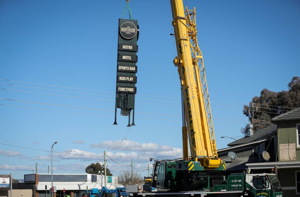 Not a bird or a plane, the eight-metre high new Northside Hotel sign is lowered into place after being constructed in recent weeks. Picture by James Wiltshire