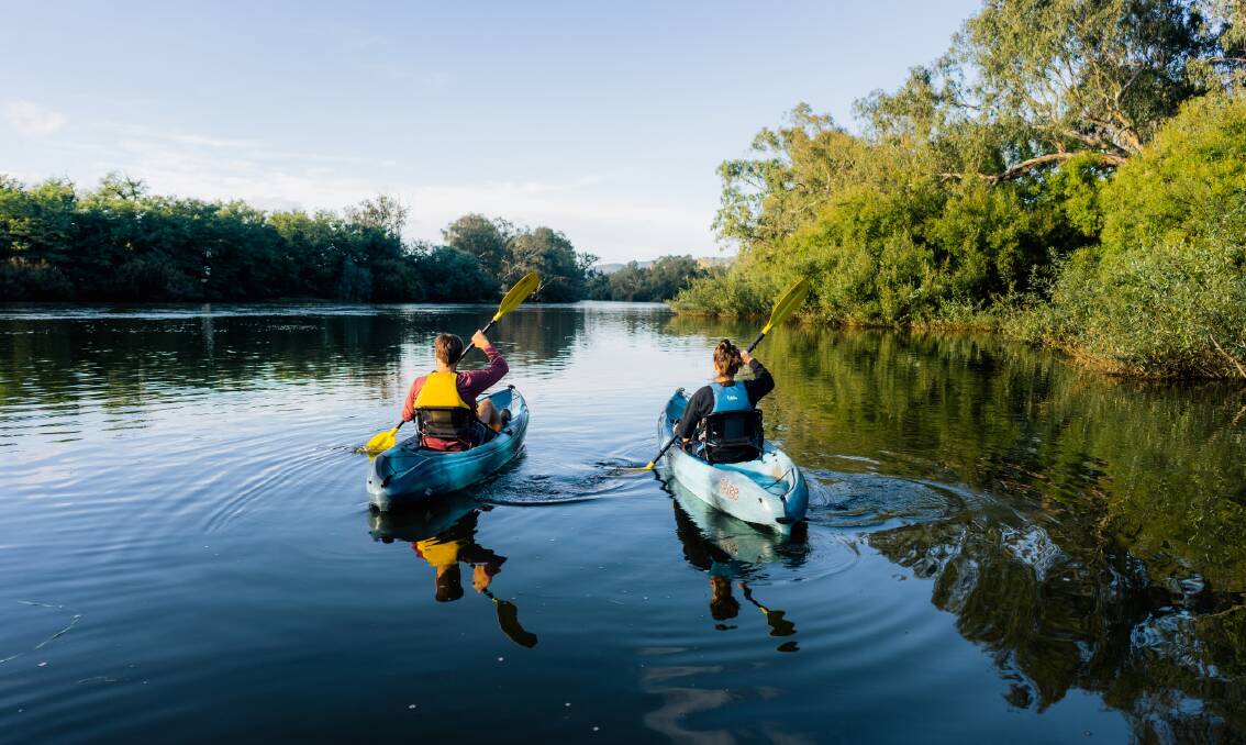 Taking in the river on the surface, kayakers paddle along the Murray. Picture from Murray Regional Tourism