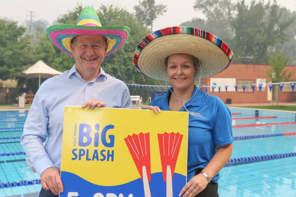 Stephen Mamouney and Albury-Wodonga pools representative Amanda Vernon promote what would become the final Big Splash in March 2020 while smoke haze lingers from bushfires in January that year.
