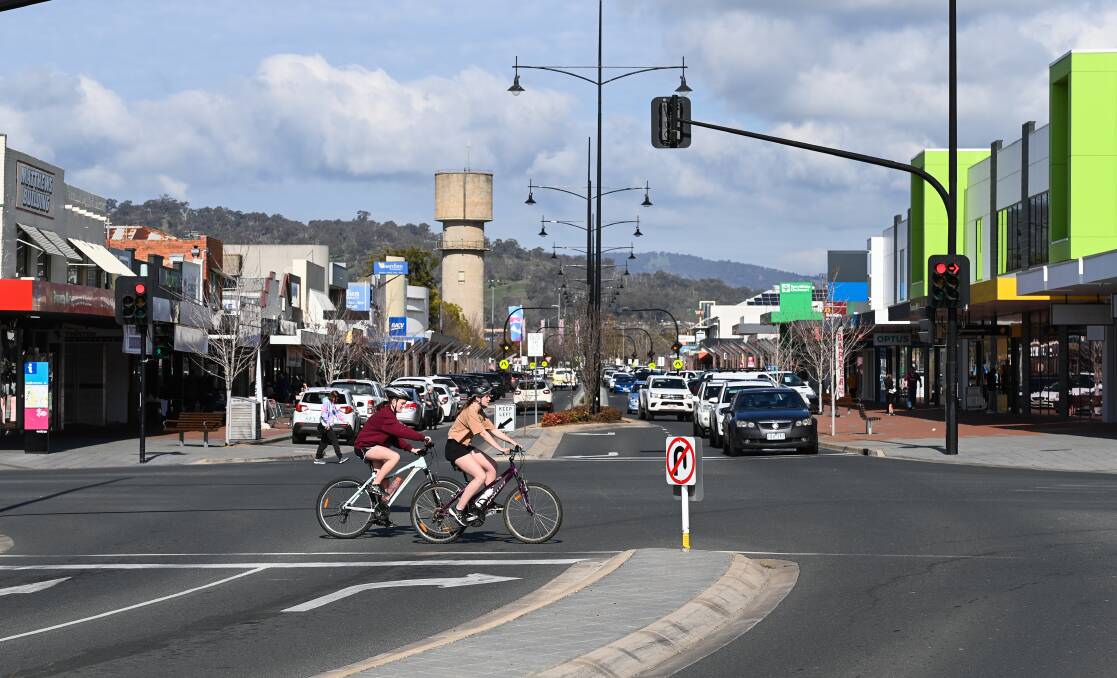Cyclists cross over High Street in central Wodonga. Councillors have argued a new Twin Cities transport plan is skewed too heavily to bikes over cars. Picture by Mark Jesser
