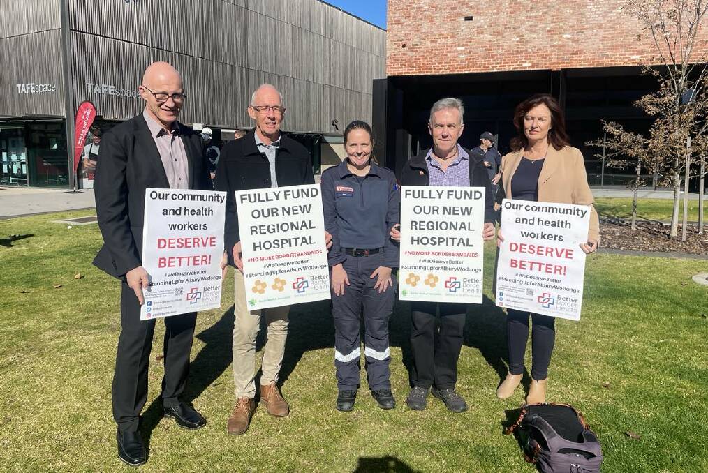 Better Border Health member Stan Stavros joins doctor Phillip Steele, paramedic Sam Burbidge, Mike Fuery and Michelle Cowan outside The Cube where a rally will be held on Sunday. 