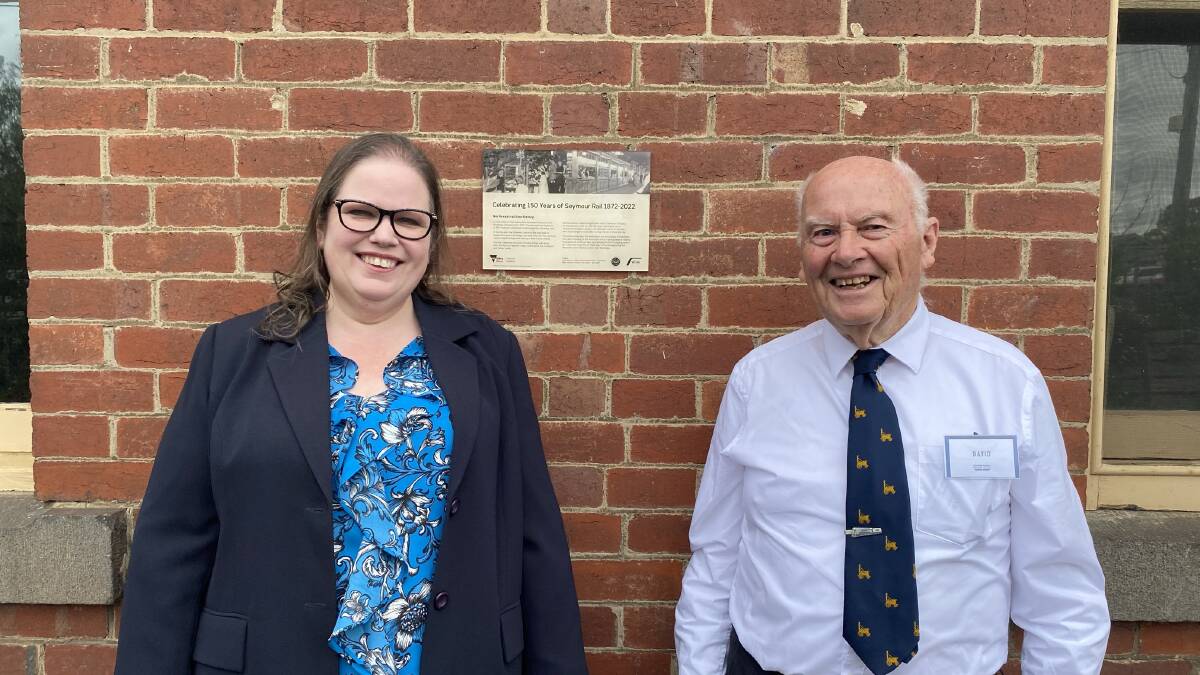 V/Line regional manager Coral Irvine and former North East VicRail superintendent David Watson with a plaque unveiled at Seymour on Saturday to mark 150 years of the North East line. Picture from V/Line