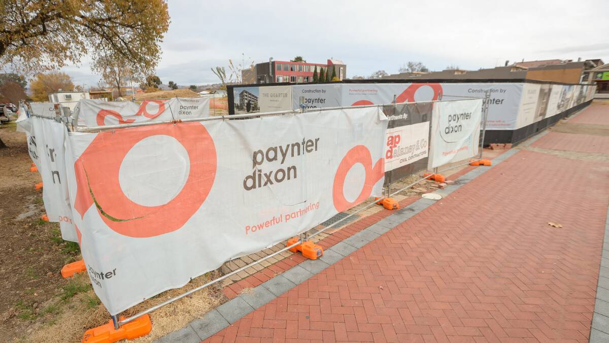 Signage on the Elgin Boulevard side of The Quarter masks the dormant construction site. Picture by James Wiltshire