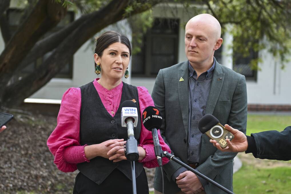Ashley Edwards and Geoffrey Hudson unveil their Greens ticket for the council election to media outside Albury's council chambers last week. Picture by Mark Jesser