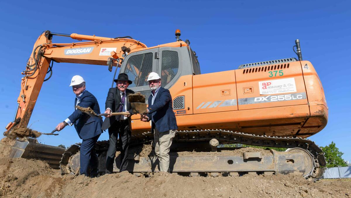 Criterion Property Group boss John Mooney, Wodonga mayor Ron Mildren and Paynter Dixon manager Kirk Bolte turn dirt to mark the start of construction on The Quarter. Picture by Tara Trewhella