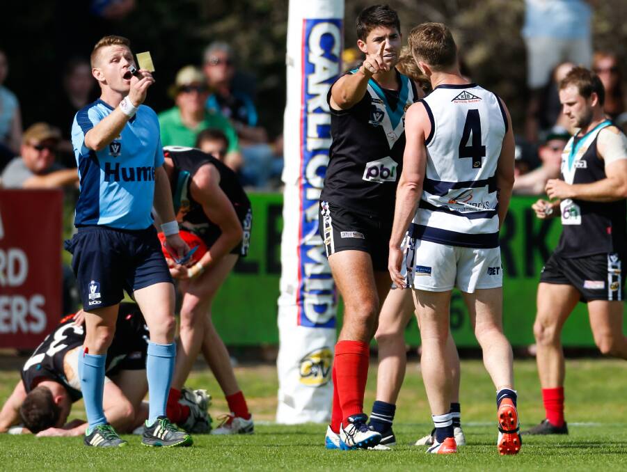 TAKE A WALK: Yarrawonga star Kayne Pettifer is shown the yellow card by the umpire and the way to the bench by Tom Yensch.