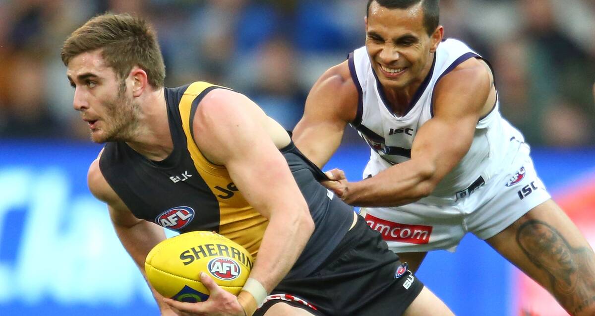 COMING TO GRIPS WITH THE AFL: Howlong's Anthony Miles knows his spot isn't safe at Richmond, even though he played every game in 2015. Picture: GETTY IMAGES