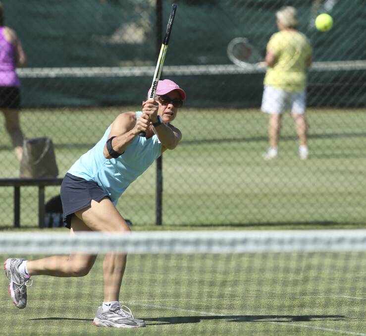 GREAT SHOT: Sally Bulle gives everything to this double-handed backhand in Tuesday ladies action at Albury. Picture: ELENOR TEDENBORG