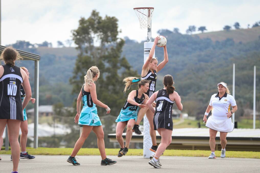 FLYING HIGH: Wangaratta's Amanda Umanski wins the ball from Lavington's Sarah Meredith in the top five clash. The home team led at quarter-time before the premiers rallied. Picture: JAMES WILTSHIRE
