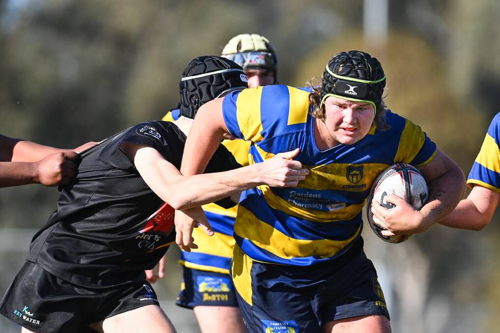 DETERMINATION PERSONIFIED: Steamers' Dylan McDowell charges at his Griffith opponent during the under 16 clash in a gala day at Alexandra Park. The event attracted clubs from the Southern Inland competition. Picture: MARK JESSER