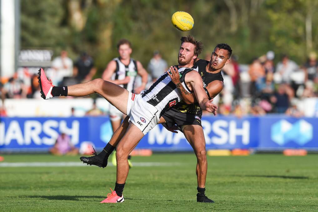 Tom Phillips (front) played for Collingwood against Richmond at Wangaratta's Norm Minns Oval in March, 2020.