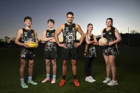 Mat Walker (centre) and his cousin Jasmine Walker designed Albury's Indigenous Round clothing. Walker was at training with Beau McCloskey, 17 (left), Lochie Butlin, 18, Ella Sears, 14 and Sara Quade, 15. Picture by Mark Jesser
