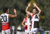 Myrtleford's Charlie Crisp (right) celebrates one of his three goals against Wangaratta last week. Picture by Mark Jesser