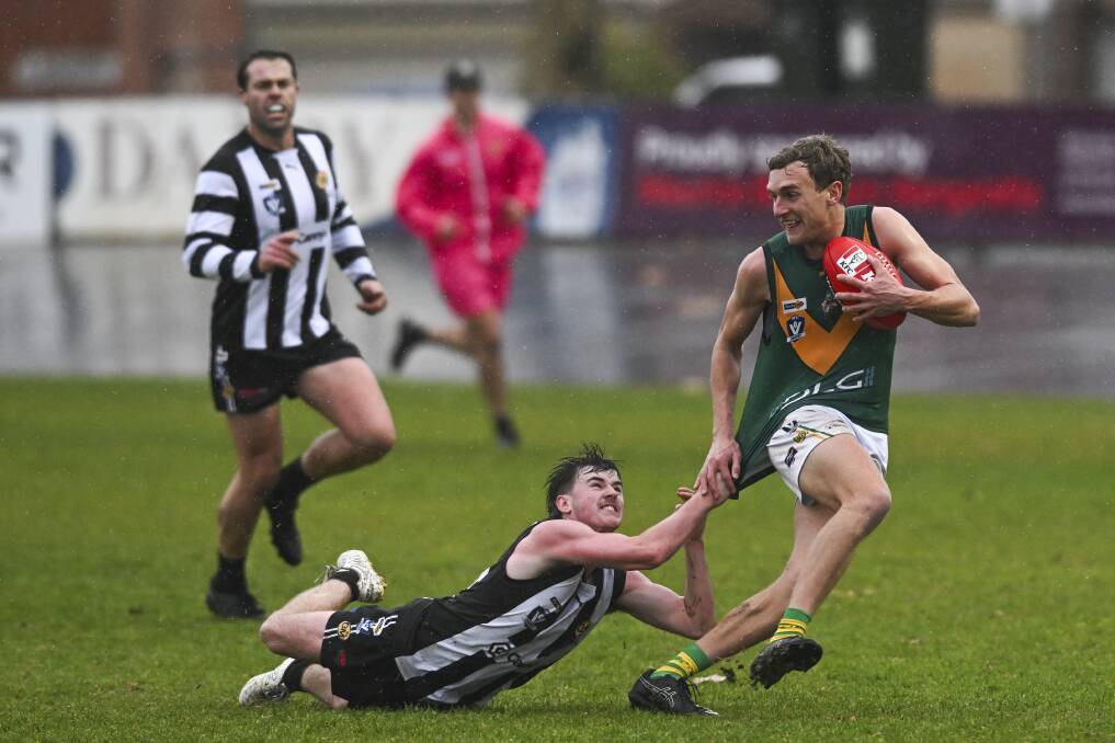 Wangaratta's Charlie Ross just keeps a hold on North Albury's Jack Reynolds on Saturday. Picture by Mark Jesser