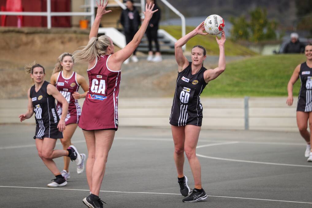 Wangaratta co-coach Hannah Grady looks for a way around her Wodonga opponent during the team's 32-goal win on Saturday. The Pies remain second, behind Yarrawonga. Picture by James Wiltshire