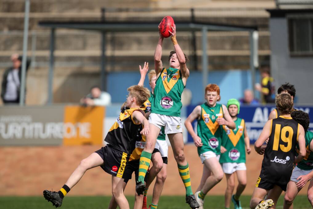 North Albury's Steele Williams takes a superb mark against Albury in the under 14 grand final. Picture by James Wiltshire