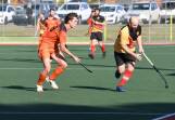 Falcons' Byron Dicks applies pressure to United's Tim Smith. Picture by Hockey Albury Wodonga
