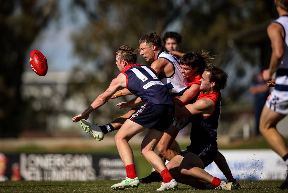 Yarrawonga coach Mark Whiley (centre) has been his club's best player and he will want pressure like this from his players against Myrtleford.
