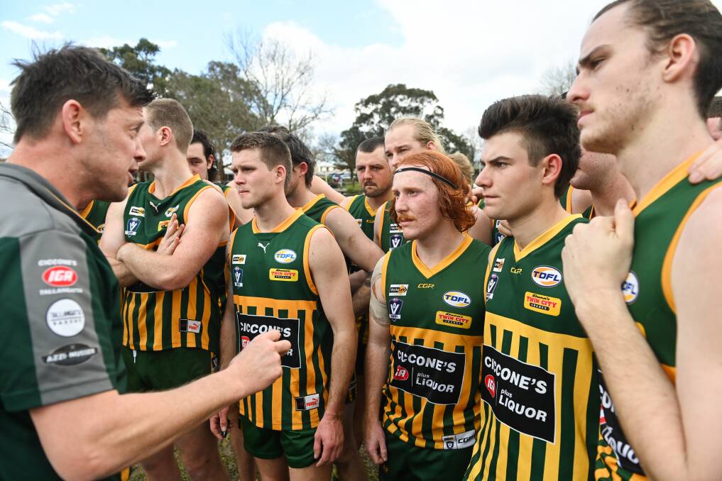 Tallangatta coach Tim Kennedy addresses his troops during Saturday's match against Beechworth. Picture by Mark Jesser