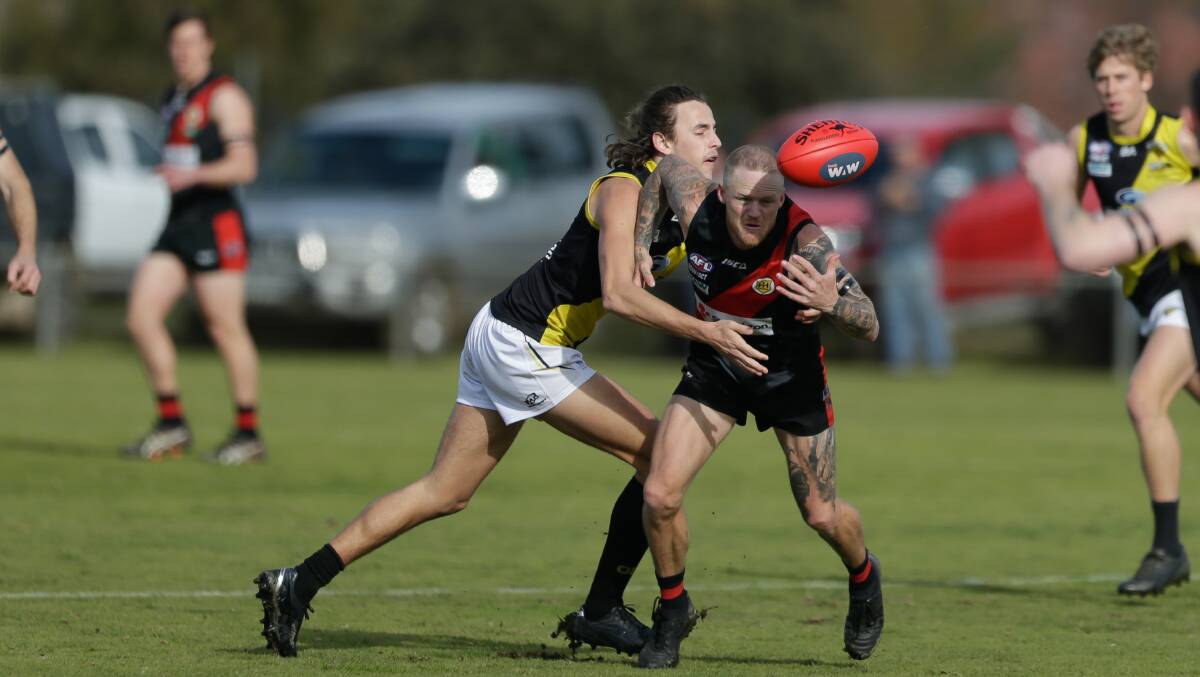 Azzi medallist Hamish Clark and Hugh Schmetzer battle for possession at Howlong on Saturday. Pictures by Tara Trewhella