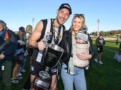 Ben Reid with wife, Erin, and son, River, after the 2022 grand final between Wangaratta and Yarrawonga. Picture by Mark Jesser