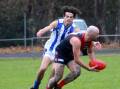 Corryong's Jarrod Woodall tries to give his Tumbarumba opponent the slip. Picture by Debbie Harrap