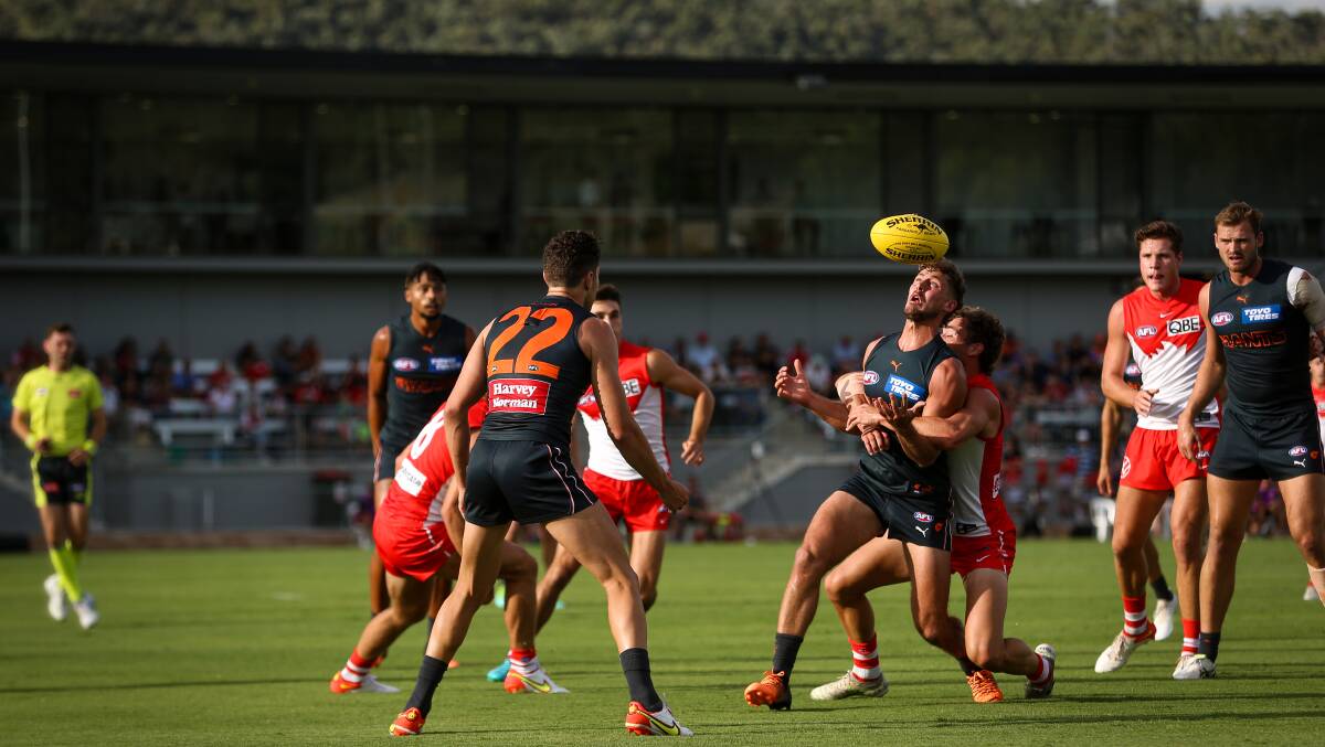 BALL: The match was played at a high intensity with the AFL season set to commence on March 16 with the grand final replay.