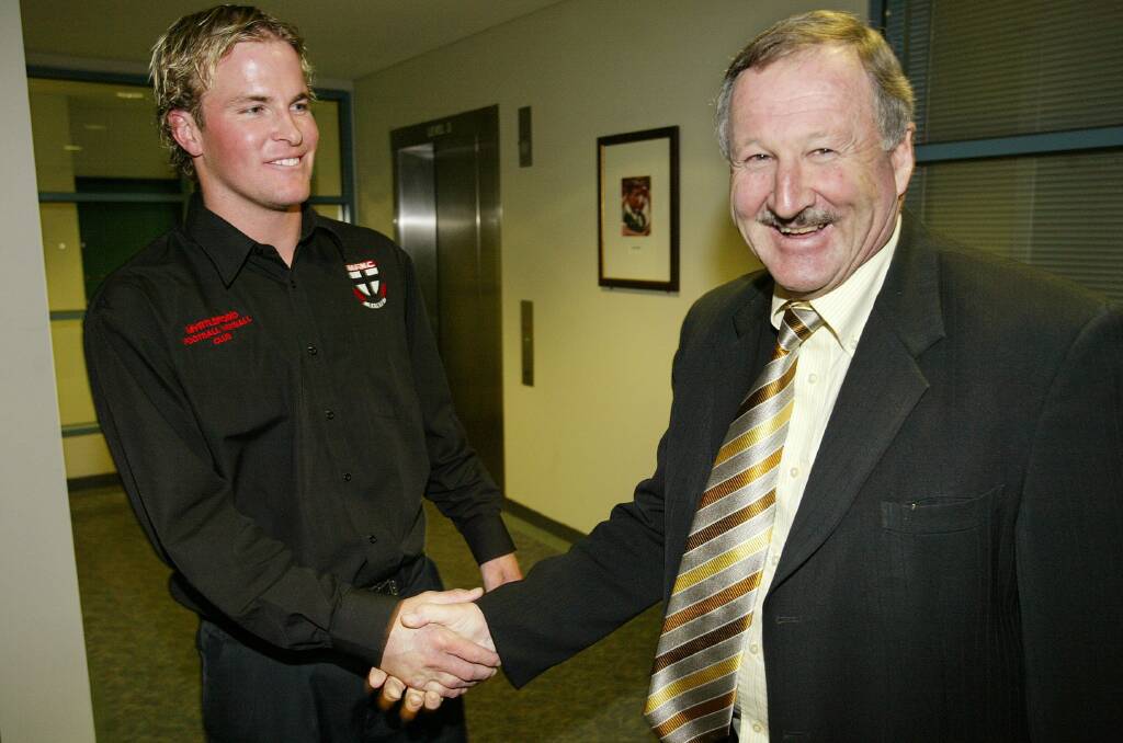 Myrtleford skipper Brad Murray with Iain Findlay after being cleared at the tribunal in the lead-up to the 2005 O&M grand final.