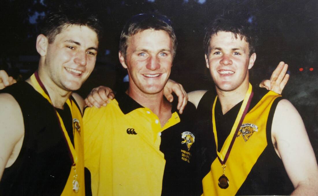 FLASHBACK: Adam Schneider (right) played in a senior flag with Osborne in 2001 before being drafted to Sydney Swans.