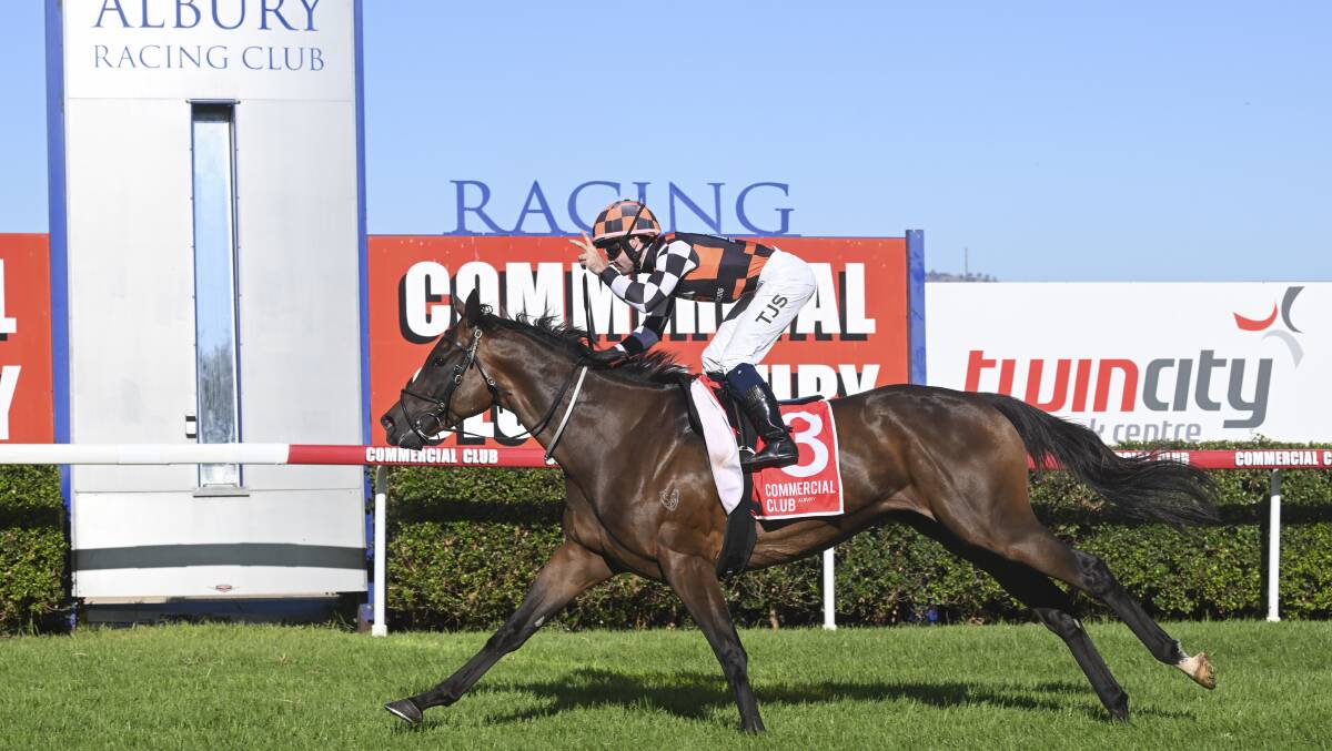 Tyler Schiller cheekily gives the two finger salute after claiming his second Albury Gold Cup victory aboard the Annabel Neasham-trained Fawkner Park on Friday. Picture by Mark Jesser