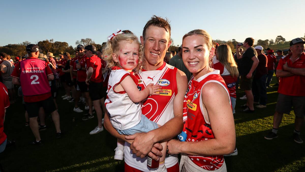 Swans coach Brad Hibberson with his wife and daughter. Picture by James Wiltshire