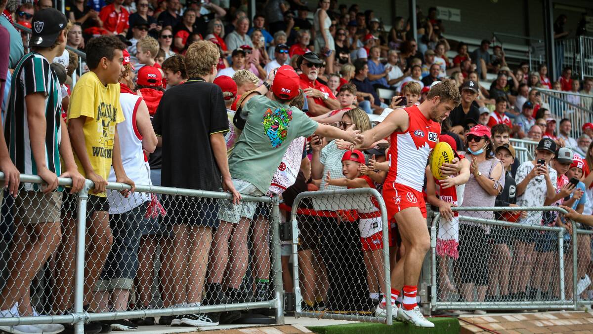 LUKE AT ME: Luke Parker steps out onto Lavington Sports Ground in front of a bumper crowd. It was perfect conditions for the practice match with no rain during the match.