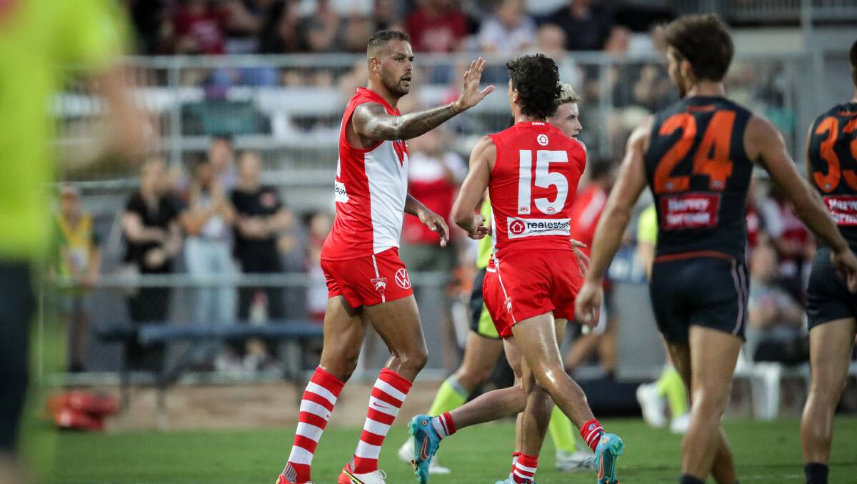 HIGH FIVE: Sydney Swans superstar Buddy Franklin celebrates a goal with teammate Sam Wicks. Franklin went for a spell after the third term.