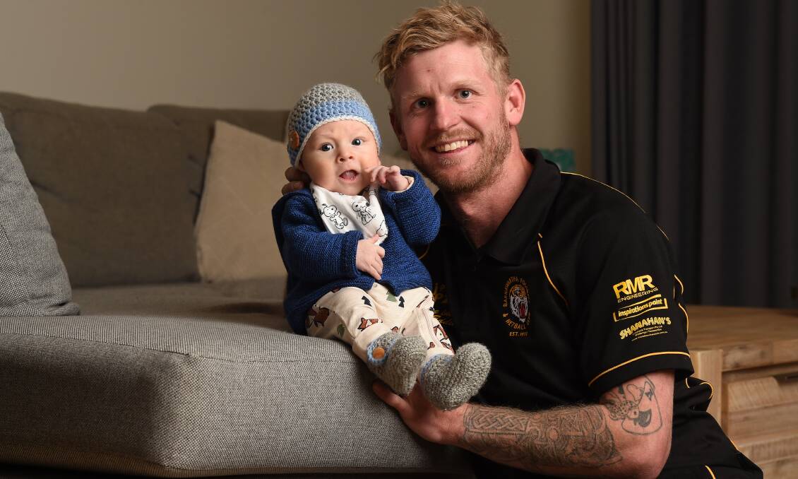 McNeill with his son, River, in 2019.